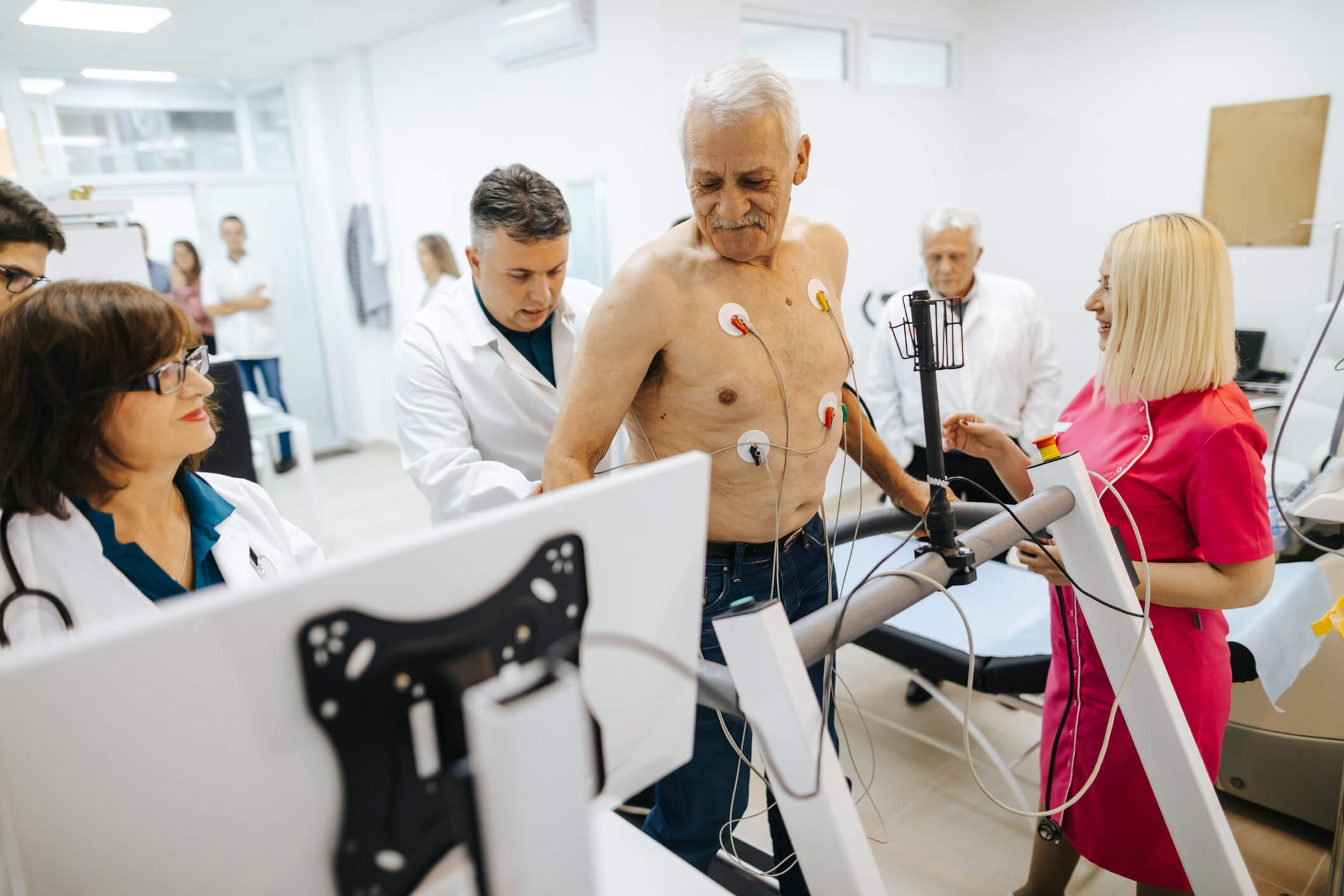Patient undergoing stress cardio test with care team